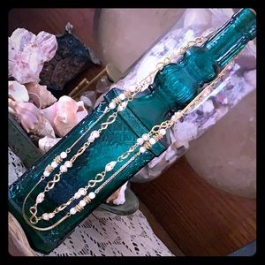 Like new , Faux Pearls / gold necklaces .